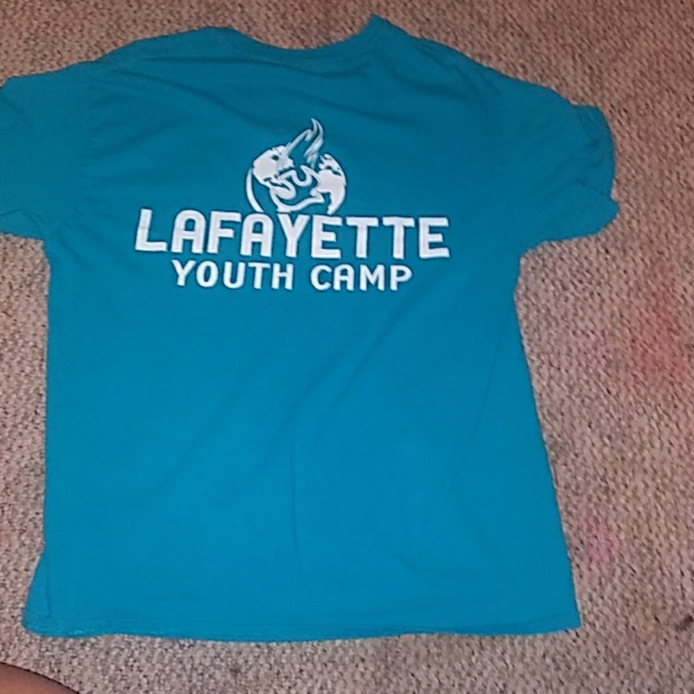 Blue camp shirt saying jesus loves you on back